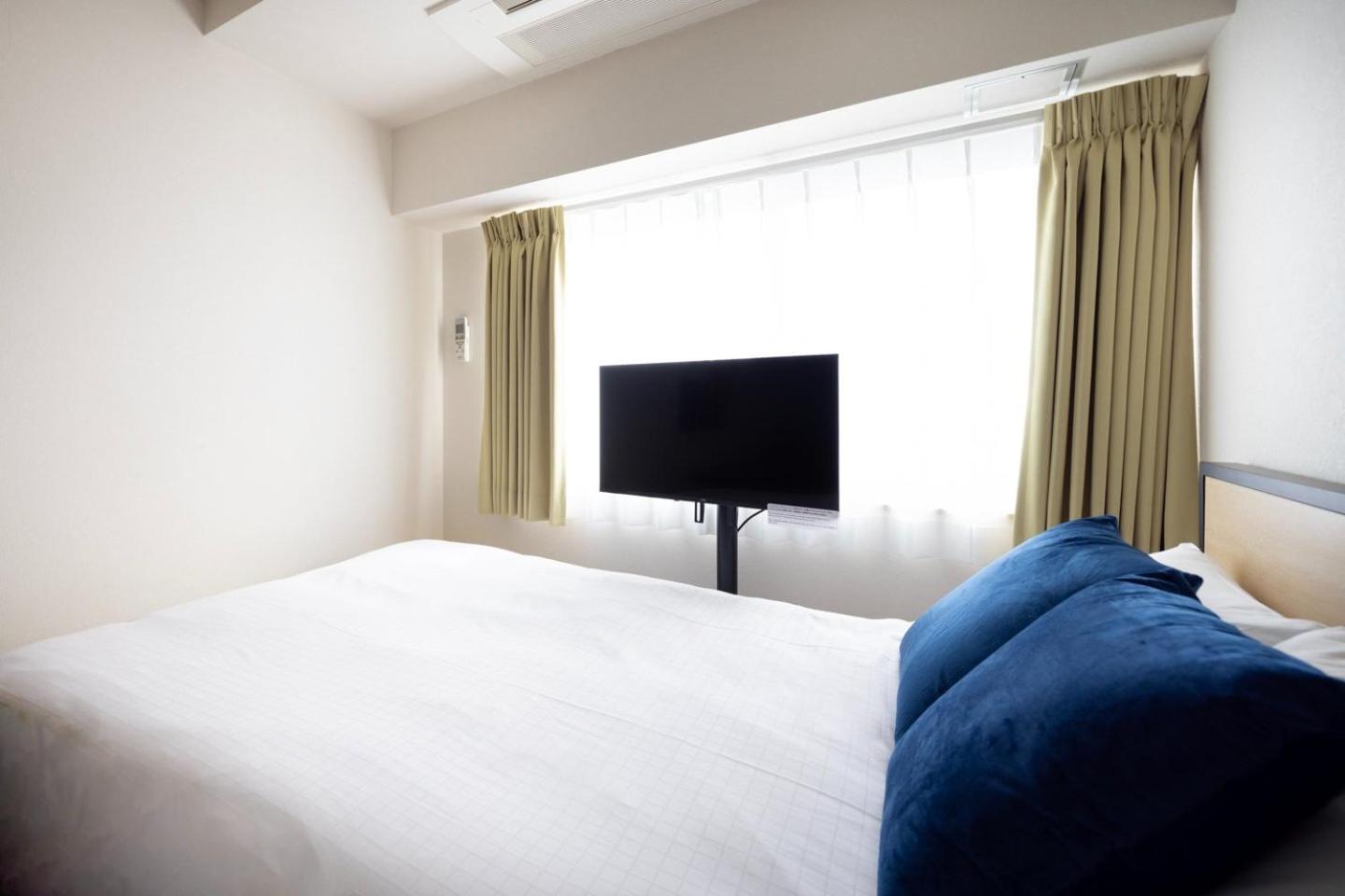 Apartamento Shinjuku Okada Building Tokio Habitación foto